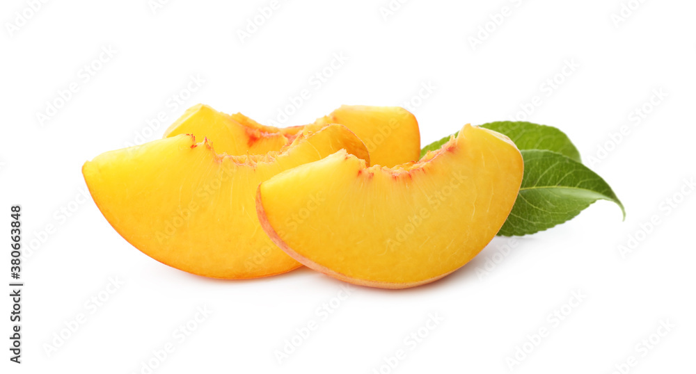 Slices of ripe peach with leaves isolated on white Slices of ripe peach with leaves isolated on white