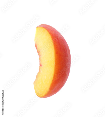 Slice of ripe peach isolated on white