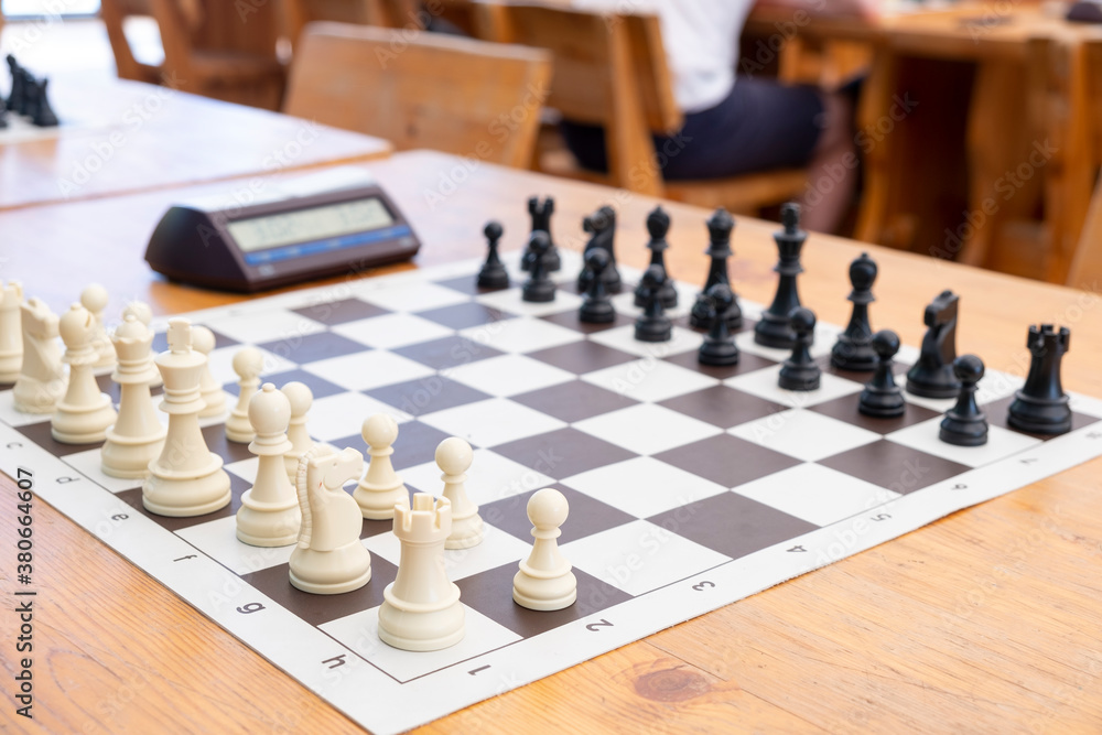 Chess tournament boards ready with chess clock chairs and tables Chess tournament boards ready with chess clock chairs and tables