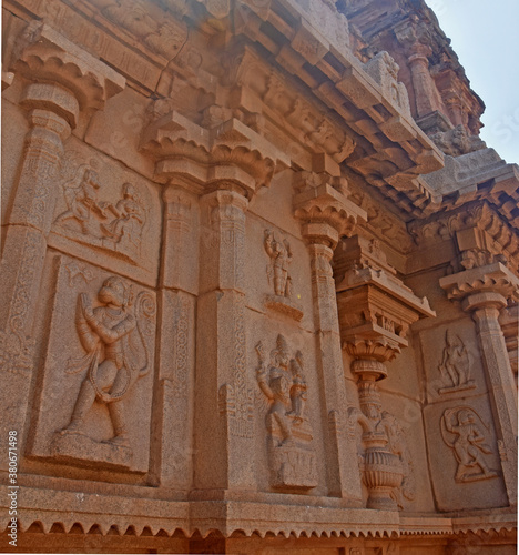 Details of Hazara Rama Temple among the ruins of Hampi from the 14th century Vijayanagara empire in Hampi, Karnataka, India. Unesco World Heritage Site. Carving stone ancient background.