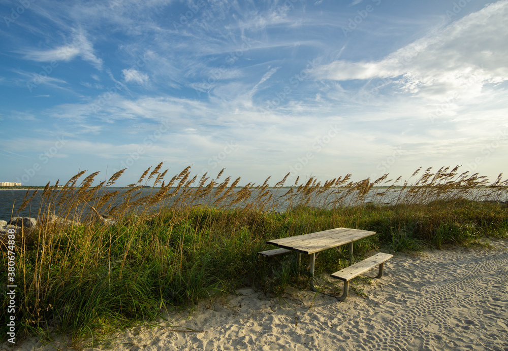 Wooden bench overlooking Ponce Inlet Jetty Wooden bench overlooking Ponce Inlet Jetty
