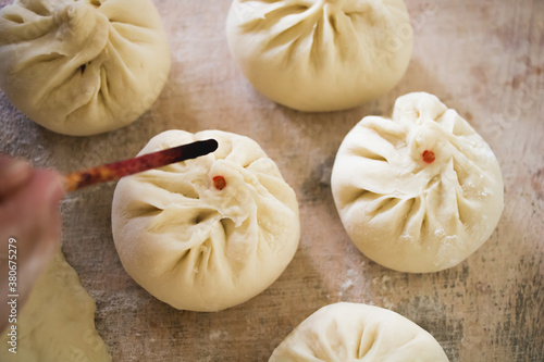 Image of making process of Chinese traditional food - baozi ( Chinese steamed buns )