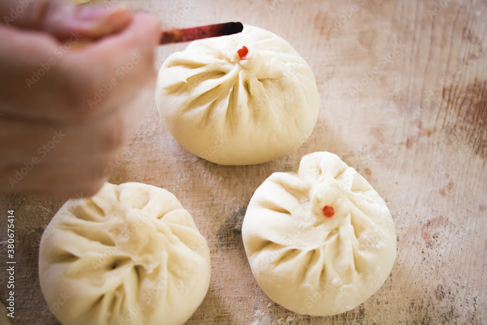 Image of making process of Chinese traditional food - baozi ( Chinese steamed buns )