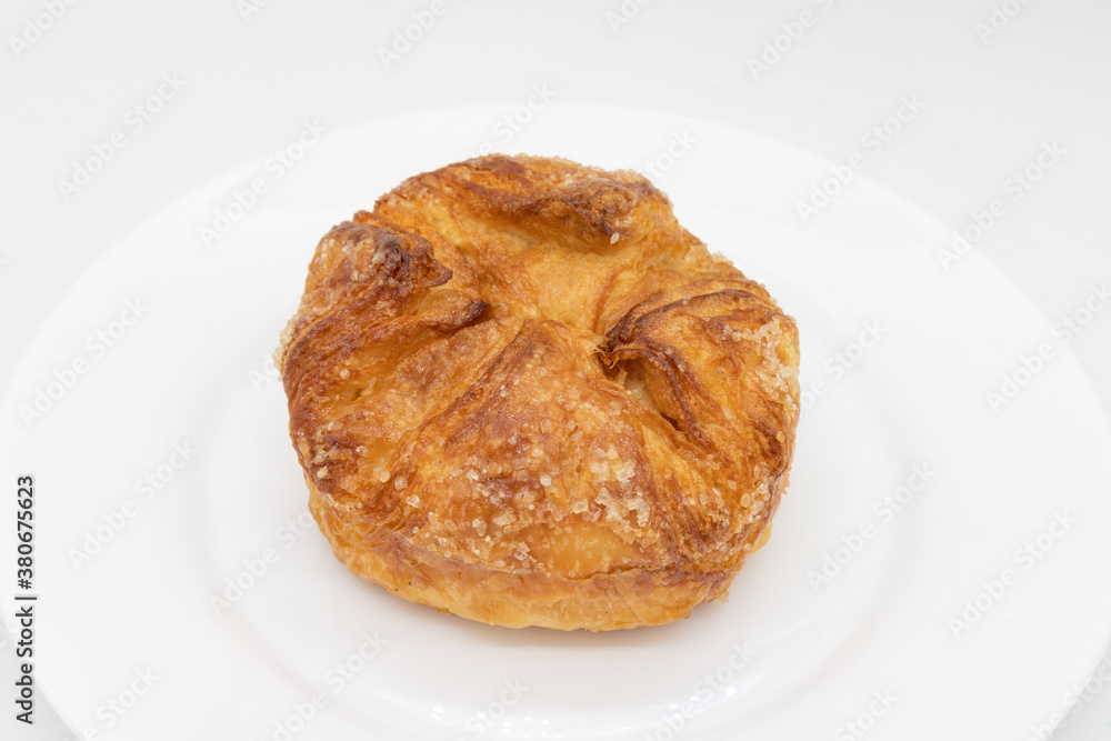 Kouign Amann Pastry on a White Plate