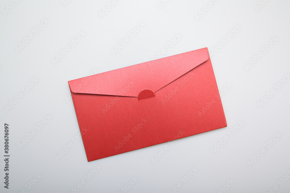 Oriental hand handing a red envelope
Oriental hand handing a red envelope