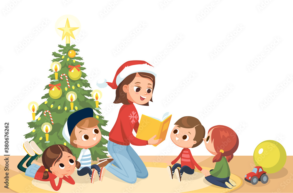 Young mother babysitter reading a book to kids at Christmas tree on Christmas Eve. Children in a kinder garden. Children listening to the teacher.