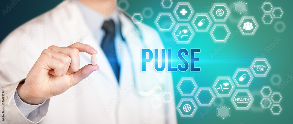 Close-up of a doctor giving you a pill with PULSE inscription, medical concept Close-up of a doctor giving you a pill with PULSE inscription, medical concept