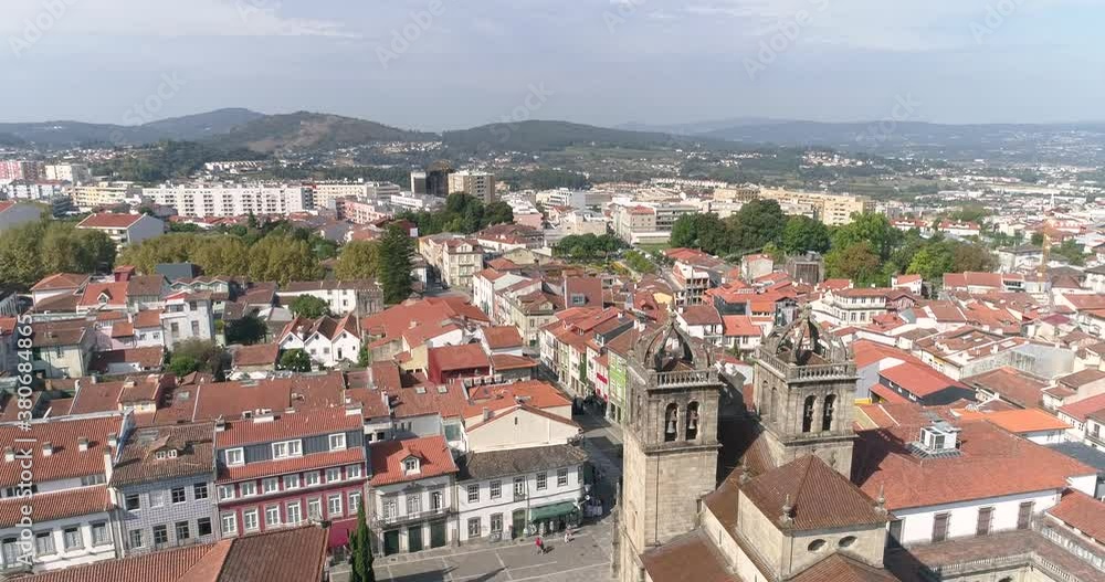 Panorama Of The City Of Braga With Traditional Red Tile Roof Houses From The Braga Cathedral On A Sunny Summer Day In Portugal. - aeriald drone shot Panorama Of The City Of Braga With Traditional Red Tile Roof Houses From The Braga Cathedral On A Sunny Summer Day In Portugal. - aeriald drone shot