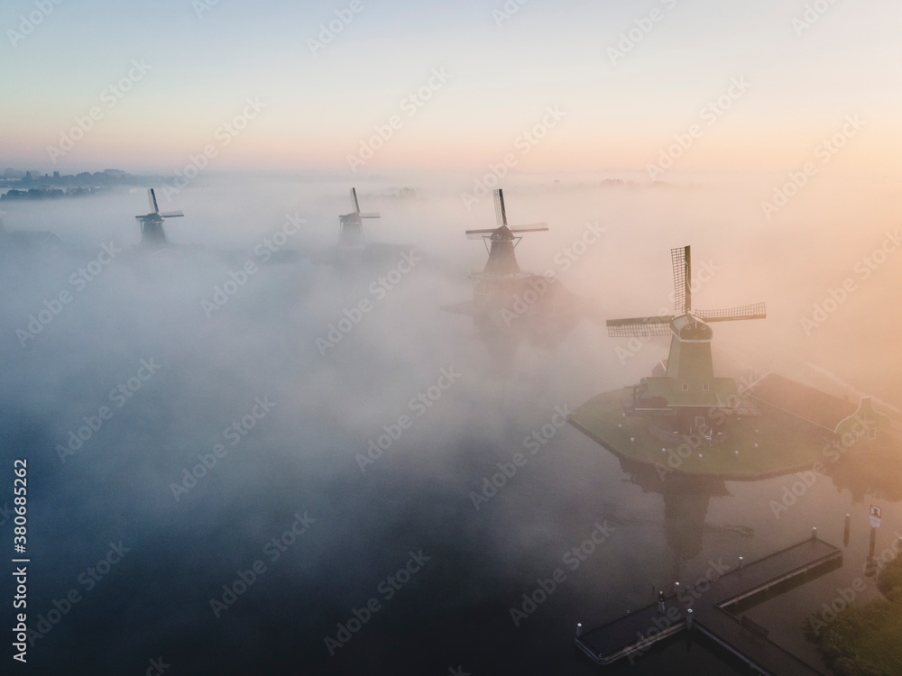 Zaanse Schans in the morning mist during sunrise Zaanse Schans in the morning mist during sunrise