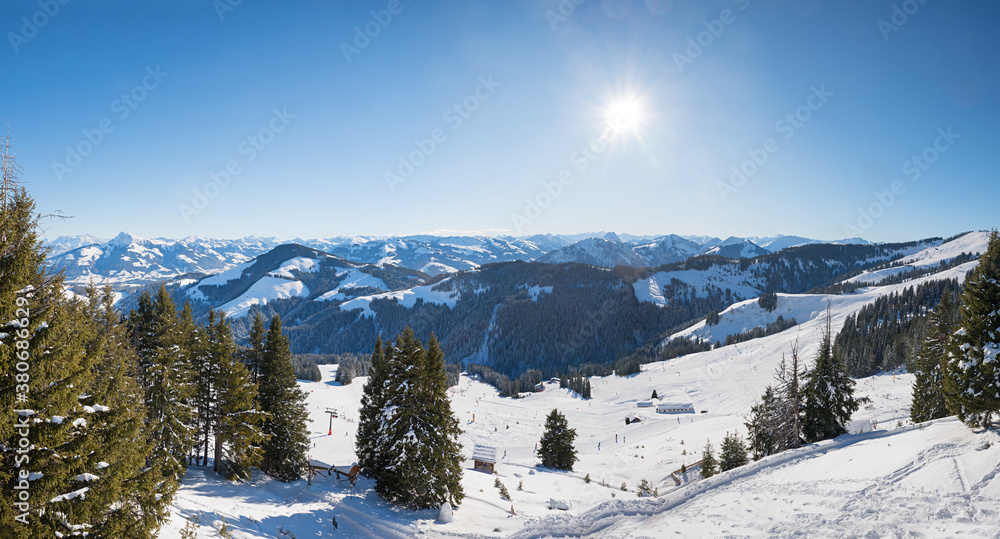 view from Hartkaiser mountain to skiing area and wintry alps