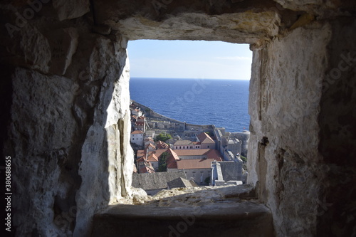 Window in the stone wall of Dubrovnik