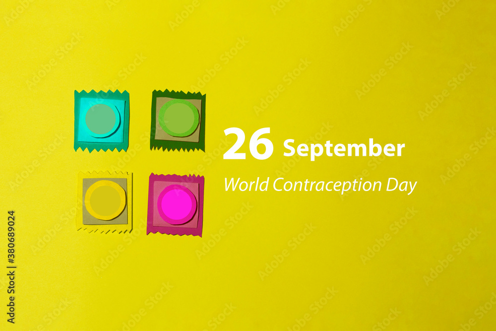 Obraz premium Four mock-ups of the condom were cut out of colored paper on a yellow background. Photo card of paper art was shot in flat lay style. Special handmade design for contraception day.