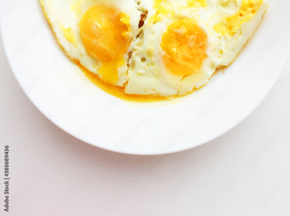 The eggs are smiling. eggs on a white plate
The eggs are smiling. eggs on a white plate