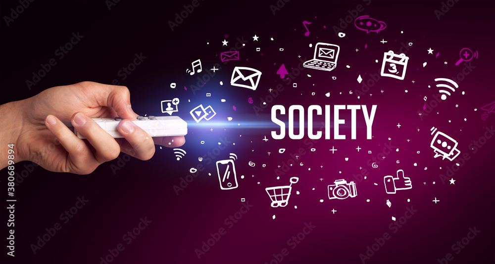 Obraz premium hand holding wireless peripheral with SOCIETY inscription, social media concept