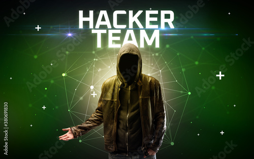 Mysterious hacker with HACKER TEAM inscription  online attack concept inscription  online security concept