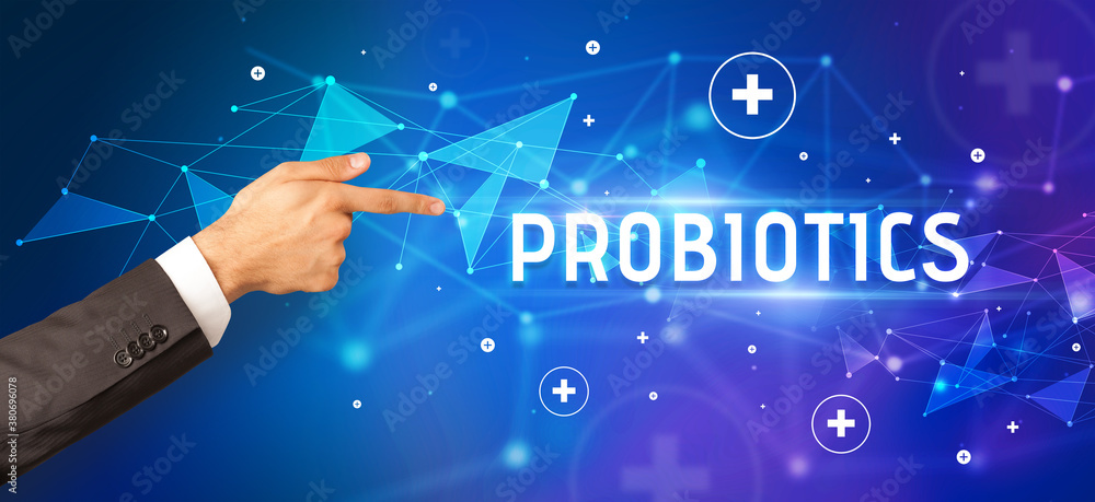 Close-Up of cropped hand pointing at PROBIOTICS inscription, medical concept