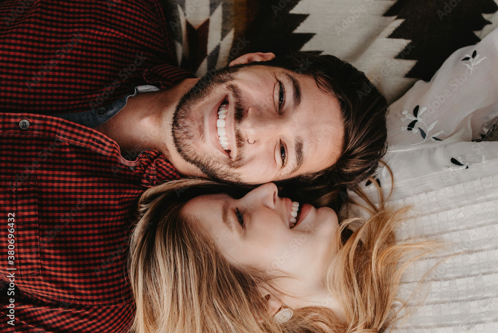 A young engaged couple posing for portraits
