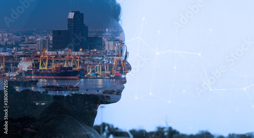 Double exposure of Smart entrepreneur woman looking at Global business connection technology interface global partner connection of Container Cargo freight ship.
