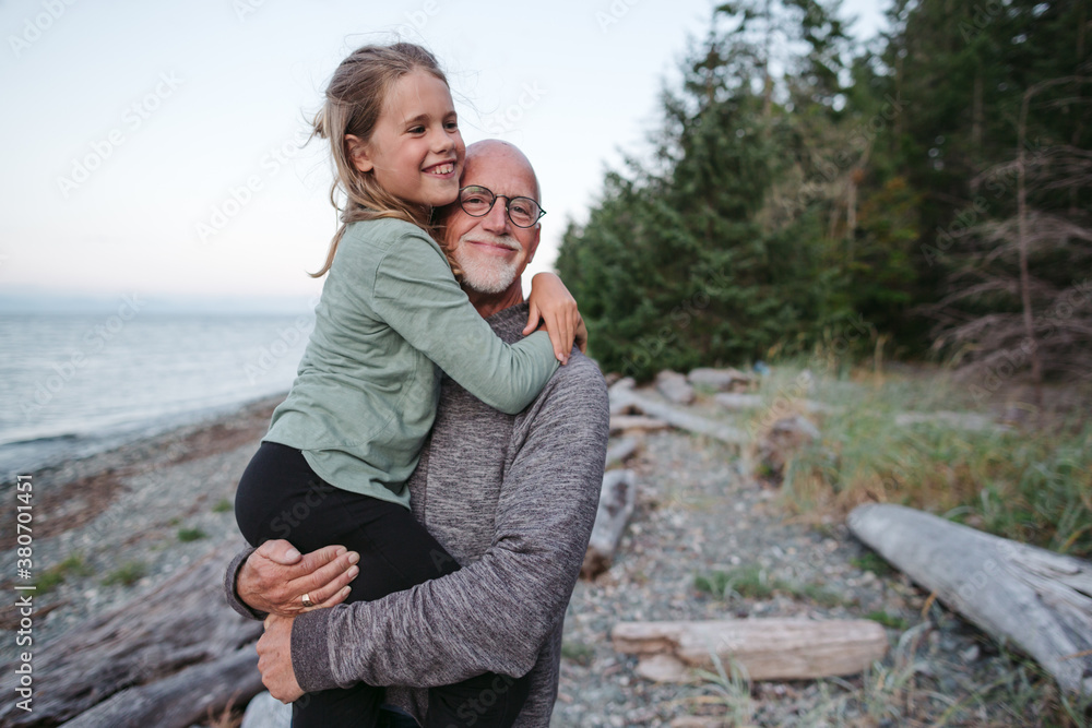 Grandfather playing with grandkid outside. Grandfather playing with grandkid outside.
