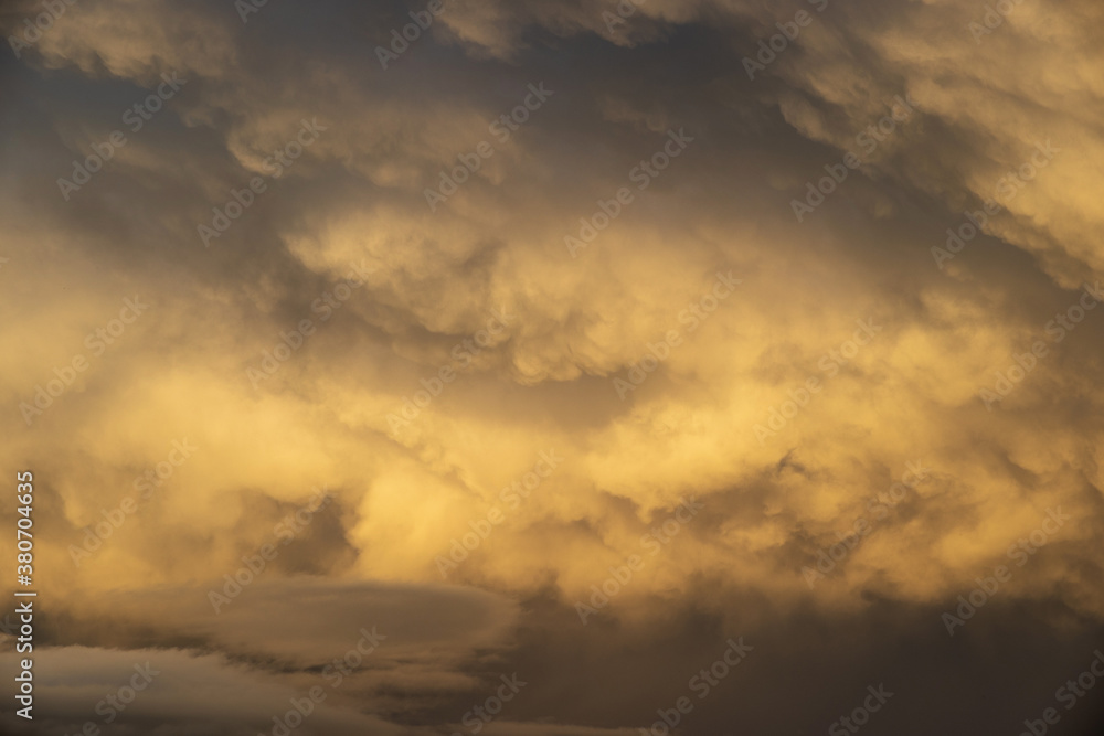 Dramatic Orange Light on a Cloud filled sky