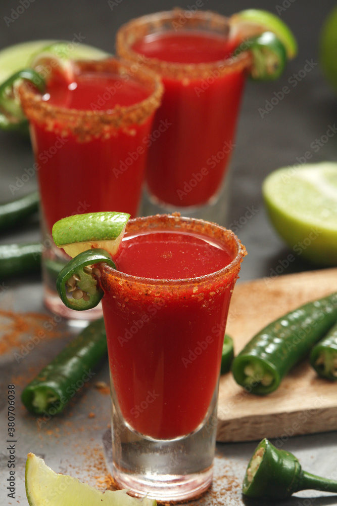 Shots with sangrita - traditional Mexican cocktail Shots with sangrita - traditional Mexican cocktail