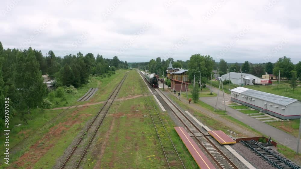 Arrival of a passenger train with a steam locomotive to the station of Kuzhenkino. Arrival of a passenger train with a steam locomotive to the station of Kuzhenkino.