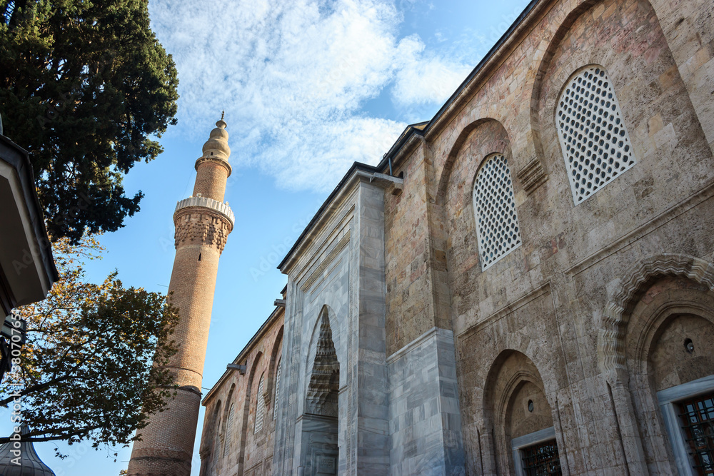 Bursa Grand Mosque or Ulu Cami with blue cloudy sky. Ulucami is landmark from Ottoman Empire and the largest mosque in Bursa.