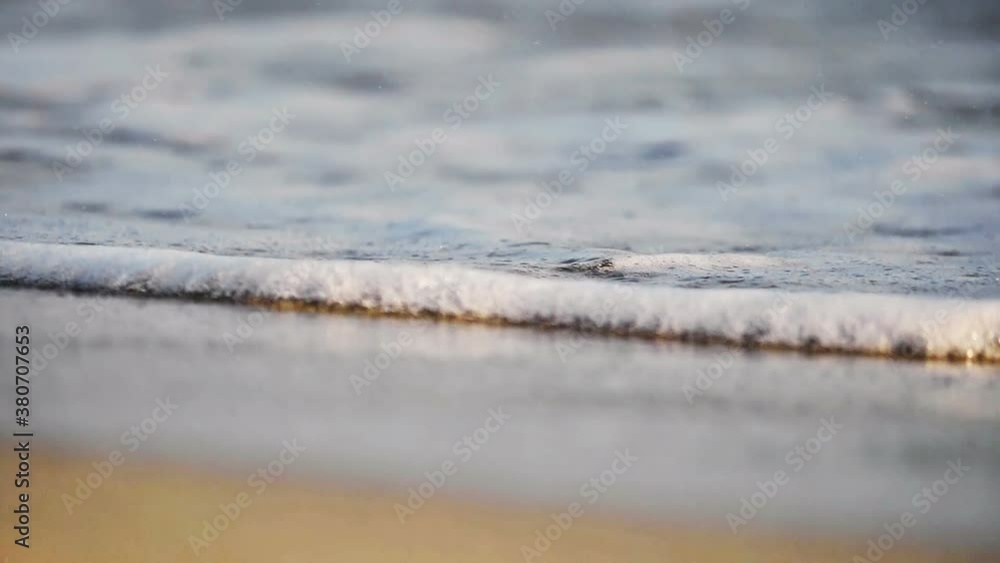 beach wave splashing macro in sunset beach wave splashing macro in sunset