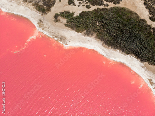 idyllic and amazing drone view of a shoreline of a salty pink sea lake saline photo