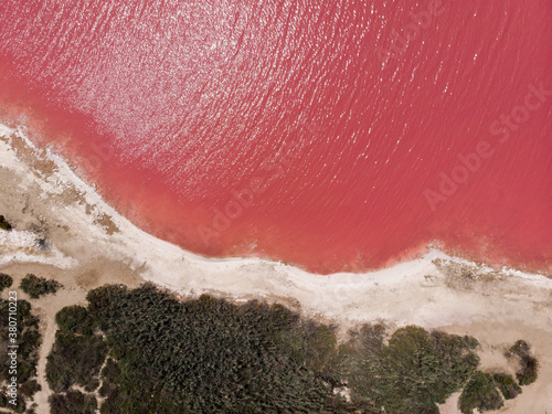 idyllic and amazing drone view of a shoreline of a salty pink sea lake saline photo