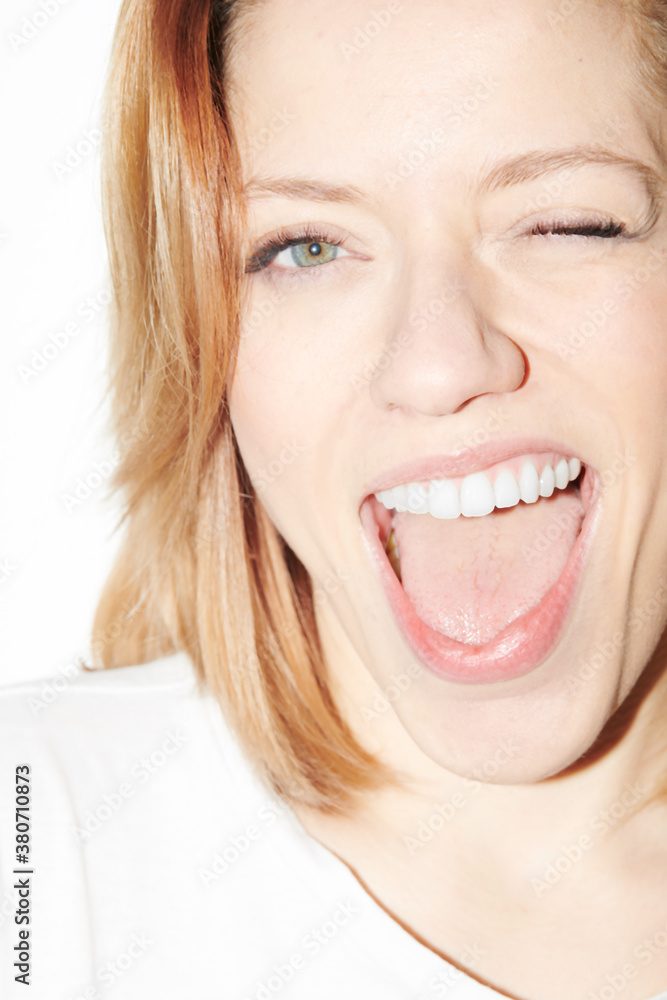 Bright happy woman winking at camera Bright happy woman winking at camera