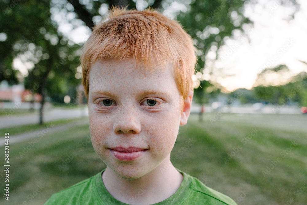 Portrait of a smiling redhead boy