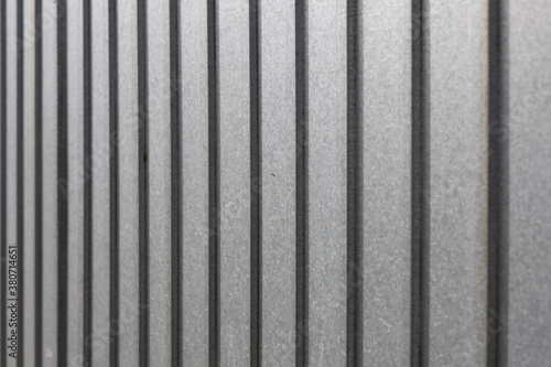Metal fence made of corrugated board.
