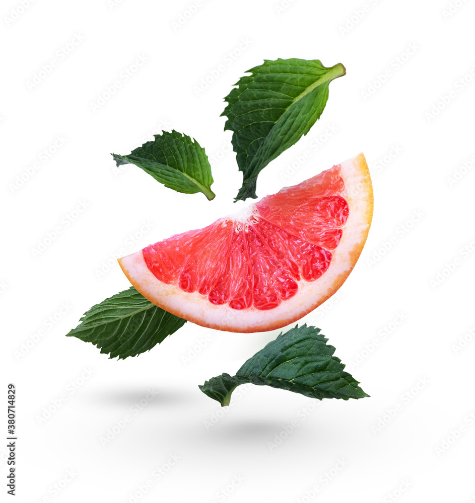 Grapefruits with green mint leaves on a white background. Falling citrus. Grapefruit Grapefruits with green mint leaves on a white background. Falling citrus. Grapefruit