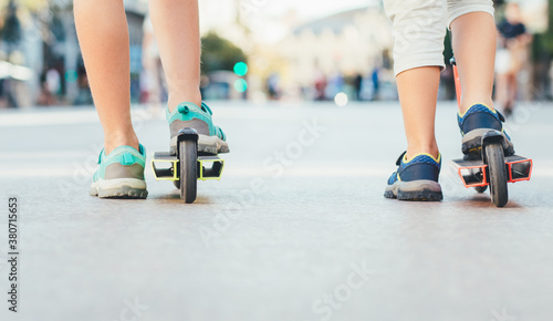 Children's feet with scooters