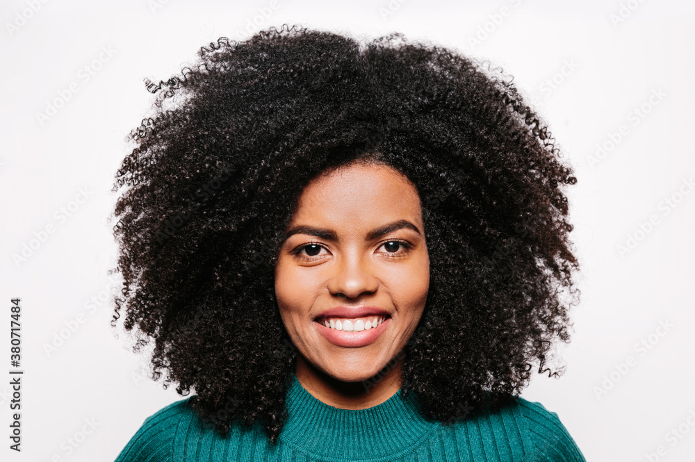 Beautiful afro woman posing over white background Beautiful afro woman posing over white background