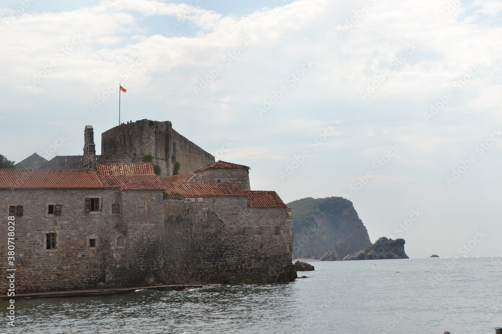 Old ancient castle on the coastline in Budva, Montenegro. August sunny day 2019