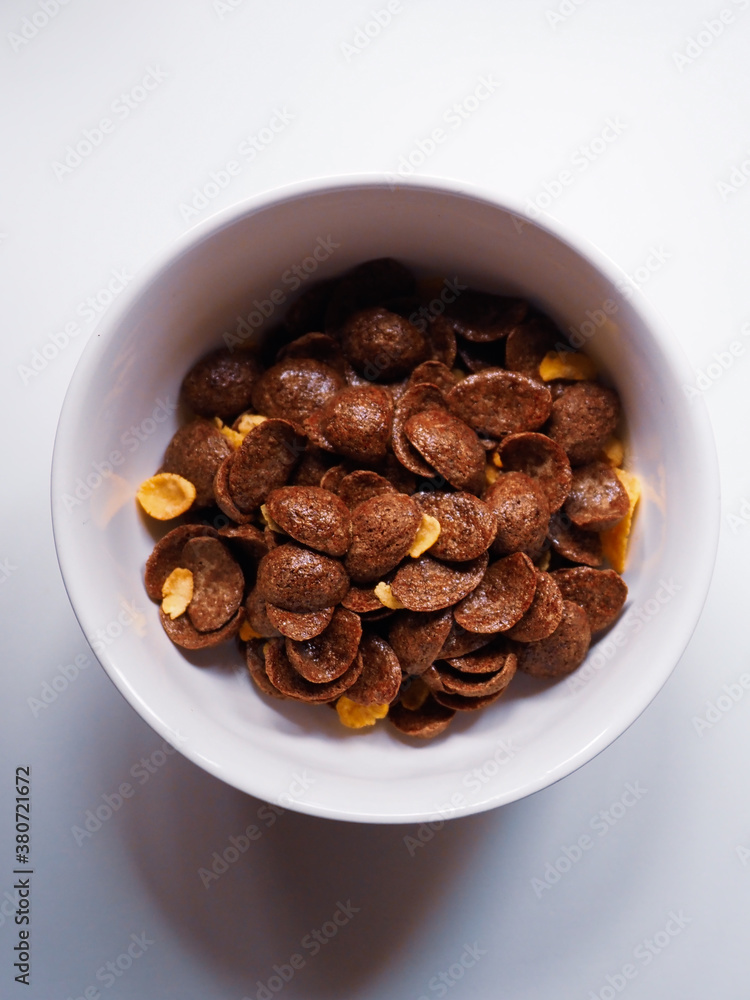 white recipe of chocolate cereals on a white table white recipe of chocolate cereals on a white table