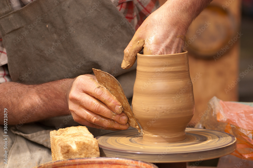 Potter shaping clay Potter shaping clay