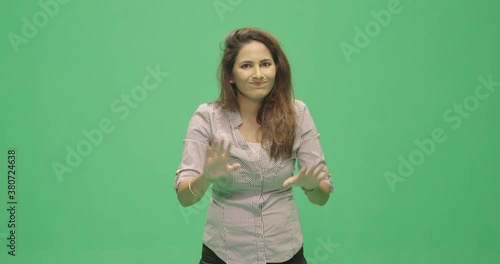 Studio, slow motion, green screen, young lecturer silences a member of the audience, London, UK photo