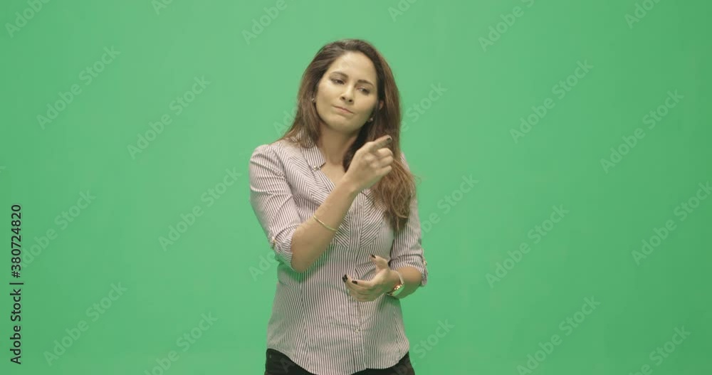 Studio, slow motion, green screen, a laughing female lecturer listens to her audience, London, UK Studio, slow motion, green screen, a laughing female lecturer listens to her audience, London, UK