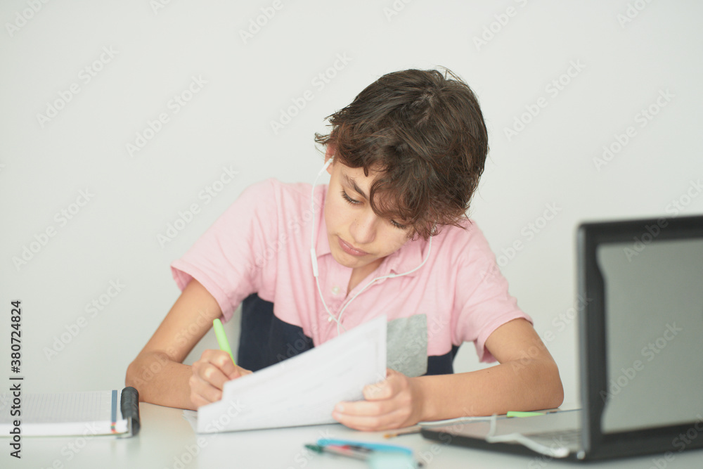 Schoolchild during online studies at home Schoolchild during online studies at home