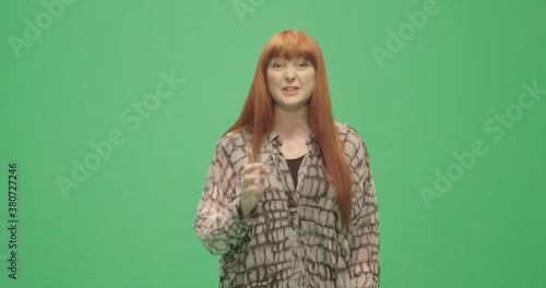 Studio, slow motion, green screen, a female lecturer silences a member of the audience, London, UK photo