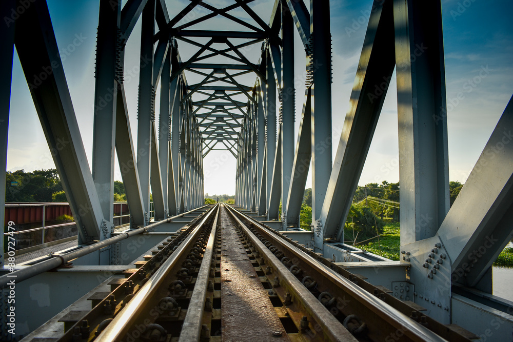 Fototapeta premium Old railway Bridge going on, Inside view in Day