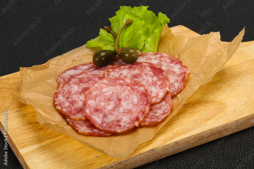 Spanish Salchichon sausage with salad Spanish Salchichon sausage with salad