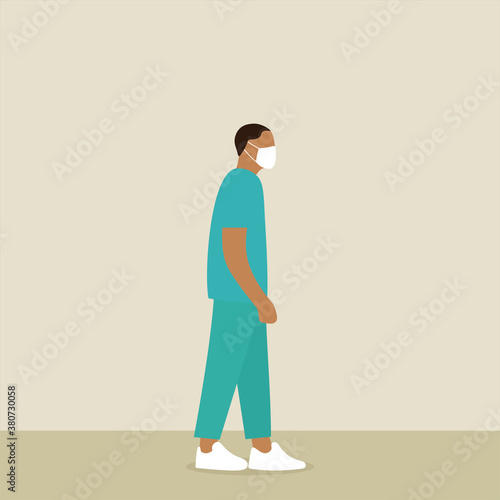 
Malenurse in uniform and medical mask