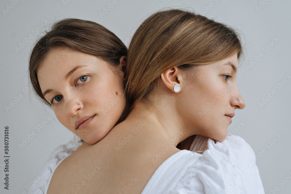 Sensual portrait of two beautiful twins blondes Sensual portrait of two beautiful twins blondes