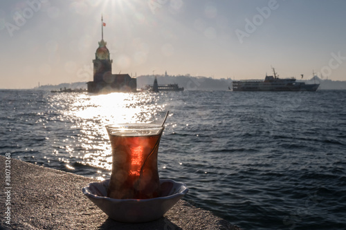 Istanbul symbols: Maiden¬¥s Tower (Kƒ±z Kulesi), a vapur and a tea on the Bosphorus photo