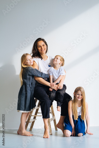 portrait of a happy family in sunny studio photo