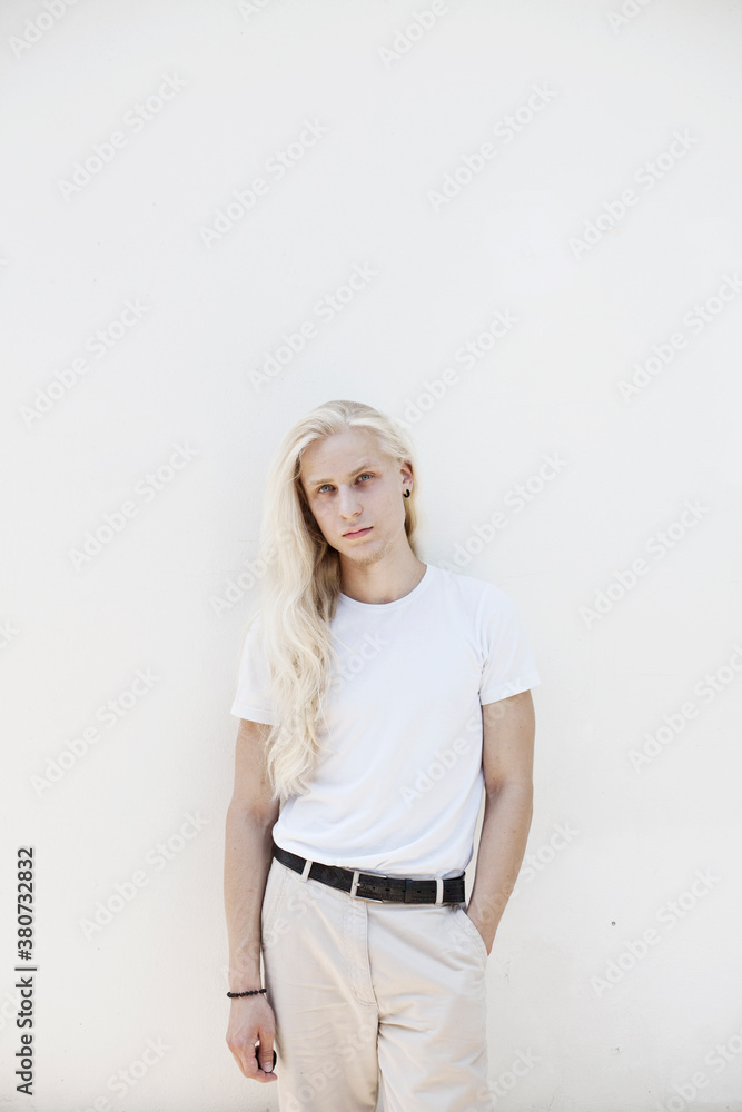 Young man in a white t-shirt with wet hair Young man in a white t-shirt with wet hair